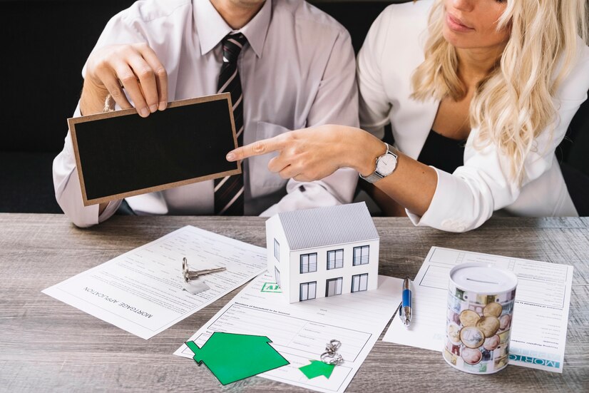 woman-pointing-chalkboard-estate-agency_23-2147764176 - Orca Insurance Group Homeowners Insurance